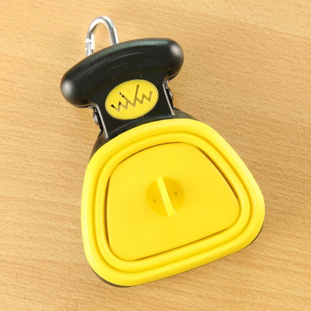 Yellow pooper scooper folded — clean product shot
